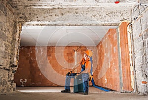 Construction Worker Inside Newly Rebuilt Building Interior