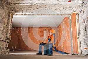 Construction Worker Inside Newly Rebuilt Building Interior photo