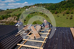 Construction worker installing a new roof