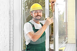 Construction worker installing new window