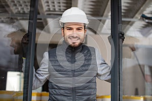 construction worker installing new window in house