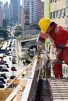 Construction Worker Installs Rebar - Vertical