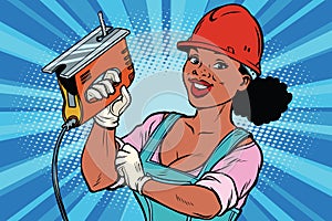 Construction worker with jigsaw. Woman professional