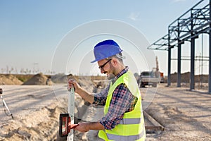 Construction worker with laser receiver