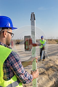 Construction worker with laser receiver