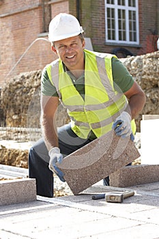 Construction Worker Laying Blockwork