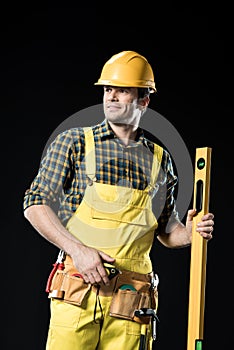 Construction worker with level tool