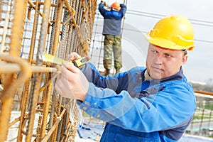 Construction worker making reinforcement