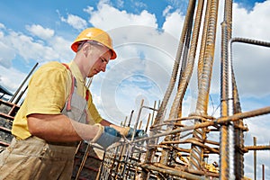 Construction worker making reinforcement