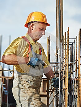 Construction worker making reinforcement