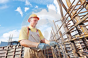 Construction worker making reinforcement