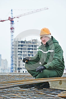 Construction worker making reinforcement