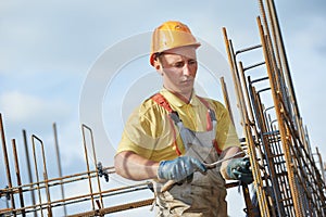 Construction worker making reinforcement