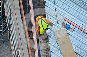 Construction worker making reinforcement in building site