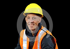 Construction worker male in yellow safety hat, orange vest, red gloves, googles and getting ready to work.