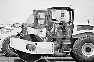 construction worker man used construction heavy machinery equipment on building industry site for roadwork outdoor