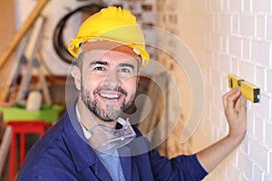 Construction worker measuring the correct level with tool