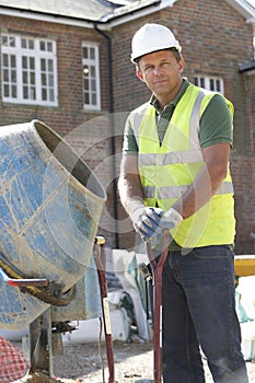 Construction Worker Mixing Cement