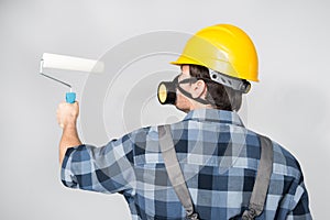 Construction worker with paint roller