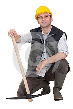 Construction worker with a pickaxe.