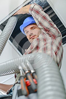 Construction worker placing pipe