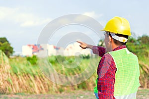 Construction Worker Planning Contractor Checking  at site gas, oil, energy and factory construction. Engineer hand point