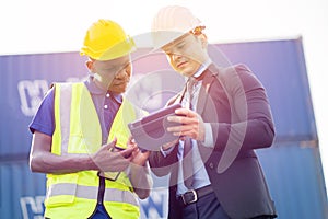 Construction worker pointing on architectural plans and architect, Engineer Concept