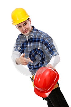 Construction worker pointing at a hardhat