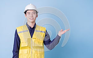 Construction worker portrait on blue background