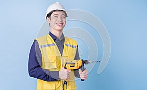 Construction worker portrait on blue background