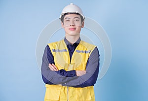 Construction worker portrait on blue background