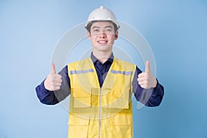 Construction worker portrait on blue background