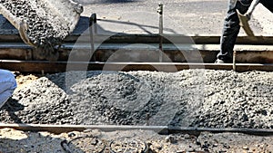 Construction worker pour cement for sidewalk in concrete works