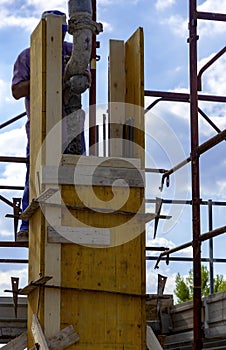 Construction worker pouring concrete