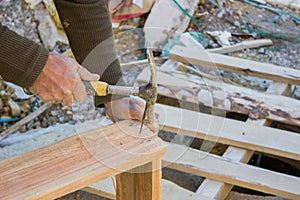 Construction worker preparing wooden formwork