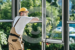 construction worker protective helmet and googles resting and looking