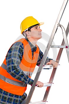 Construction worker in reflective clothing climbing a ladder.