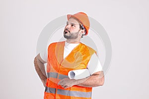 Construction Worker in Safety Helmet with Building Plans