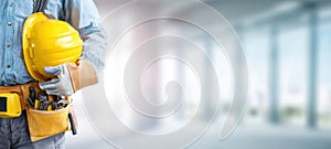 The construction worker with a safety helmet and tools in a professional setting. AI generated image