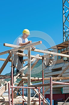 Construction worker on scaffold