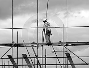 Construction worker on scaffold photo