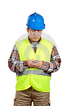 Construction worker sending sms