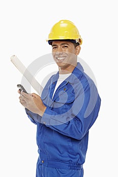 Construction worker sending a text message