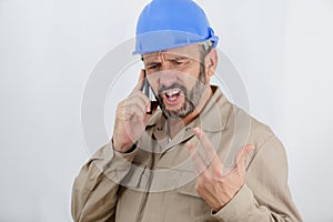 Construction worker shouting on phone