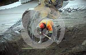 Construction worker shovel road repair drain sewer work excavation digger
