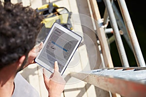 Construction Worker Signing Contract On Digital Tablet