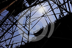 Construction worker silhouette on scaffold