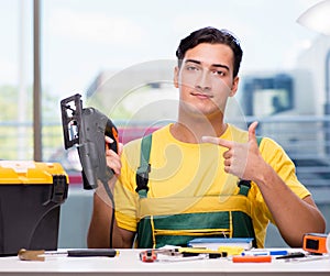 Construction worker sitting at the desk