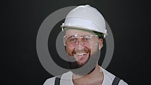 construction worker or skilled master is smiling to camera, portrait of laborer