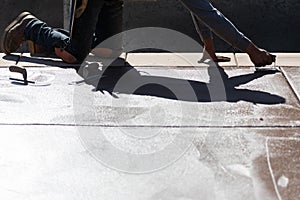 Construction Worker Smoothing Wet Cement With Hand Edger Tool